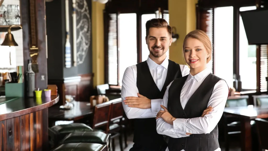 Restaurant staff representing a modern approach to menus that include 0% drinks and non-alcoholic options.