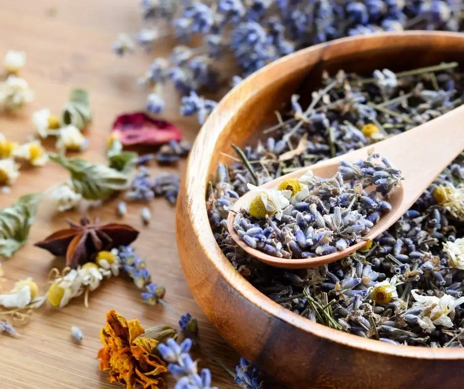 Dried herbs and flowers, including lavender and chamomile, used for natural caffeine-free infusions.