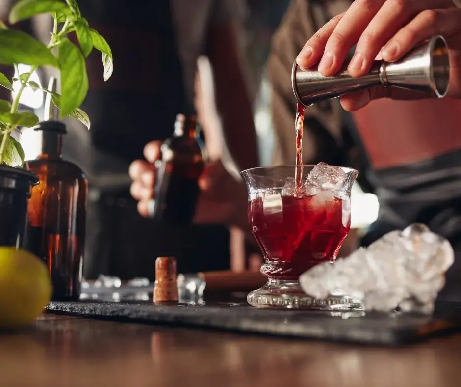 Bartender preparing a zero-proof drink as an example of standardization and cost control in hospitality operations