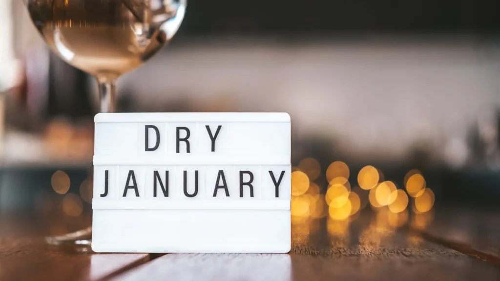 “Dry January” text on a lightbox placed on a table, symbolising a month without alcohol and a mindful lifestyle choice
